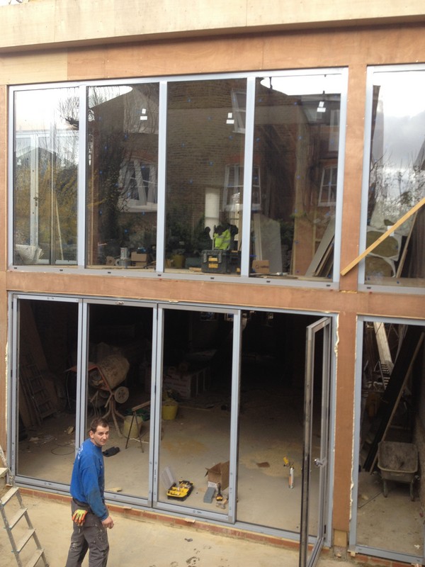 Aluminium bi-fold doors with two-storey glazing in Dunstable
