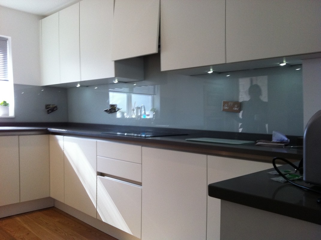 Grey glass kitchen splashback with LED lighting in Dunstable