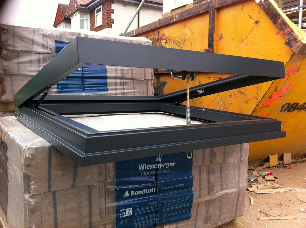 Opening flat roof skylight in anthracite grey installed in Dunstable